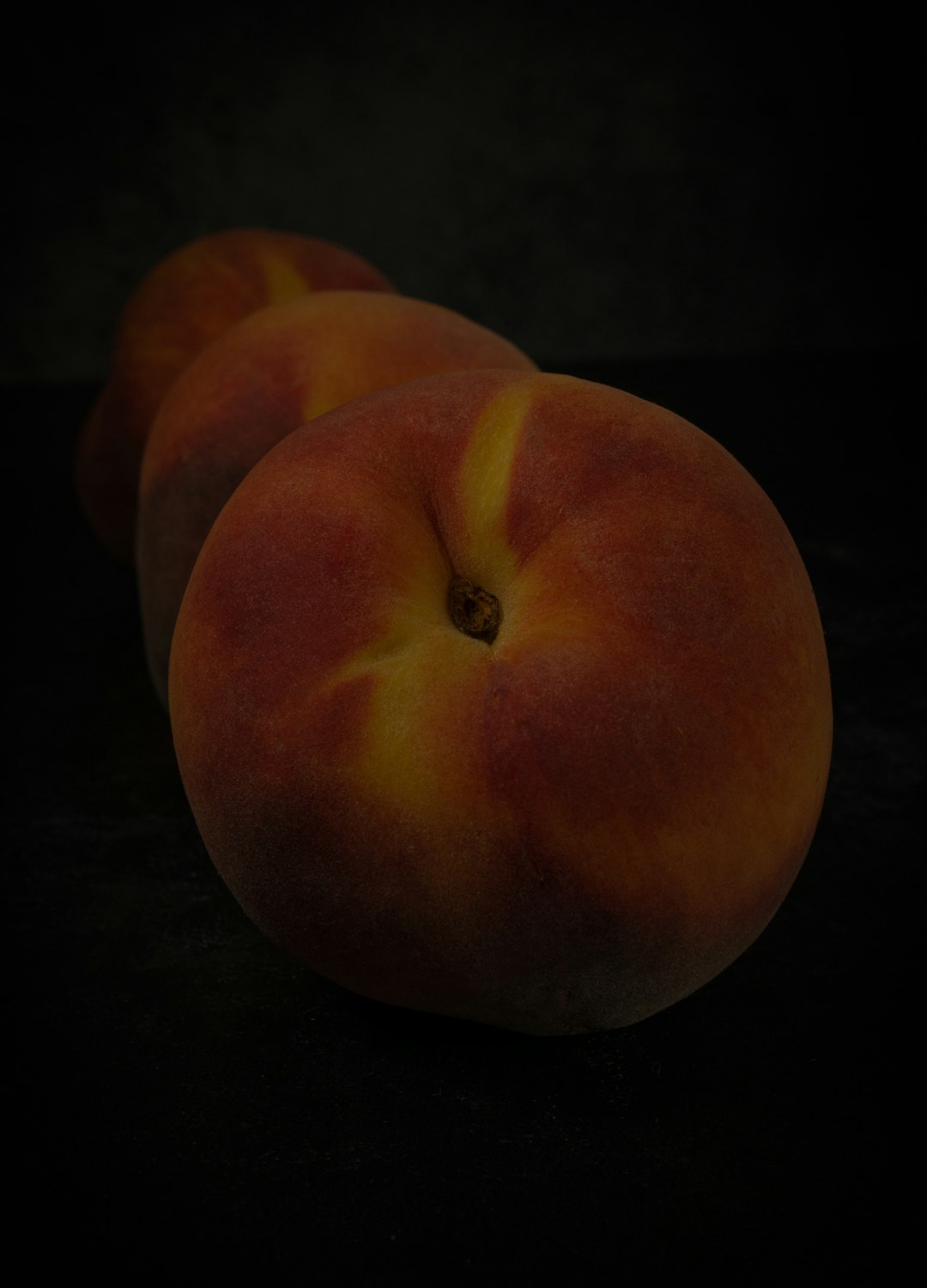 red apple fruit on black surface