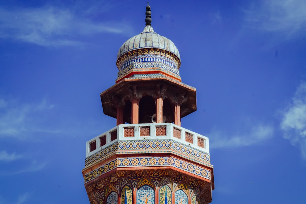 brown and green dome building under blue sky during daytime