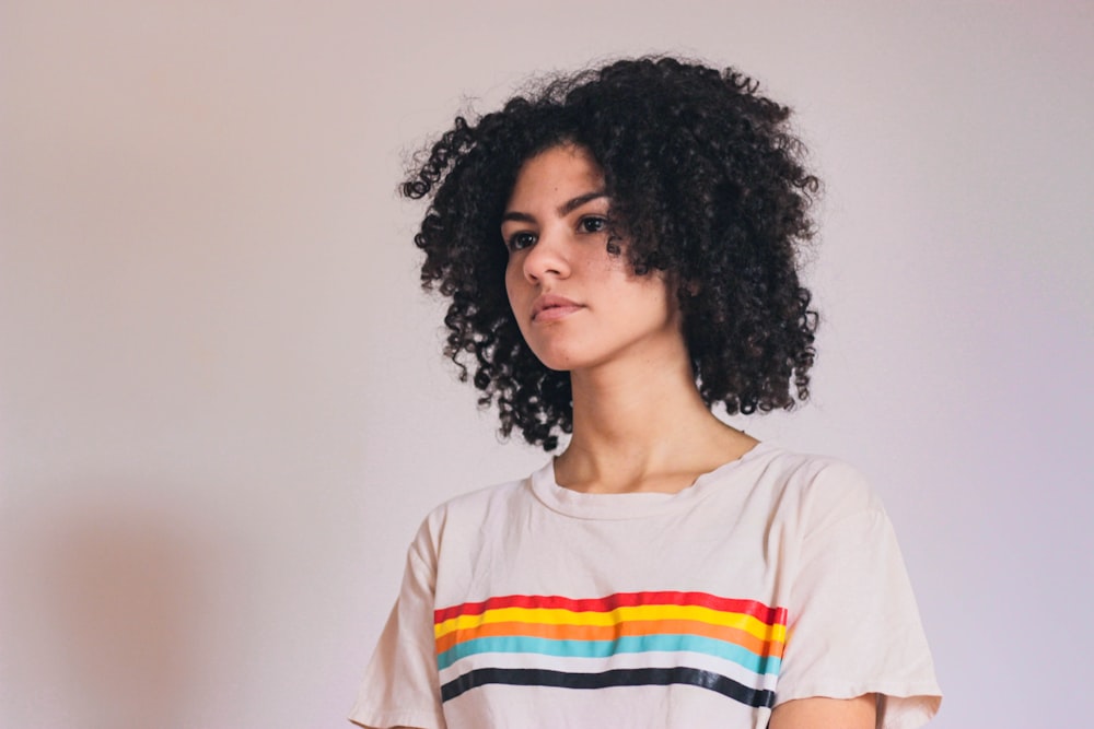 woman in white orange and blue crew neck shirt