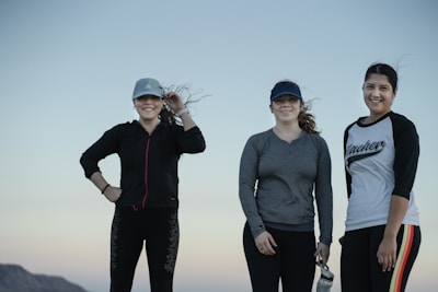 Women enjoying outdoor activities while wearing revive water athletics gear.