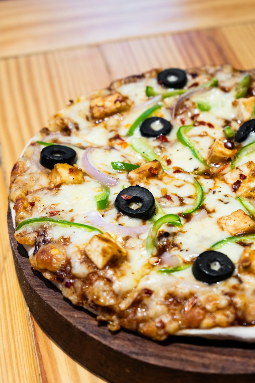 pizza with green and brown vegetable