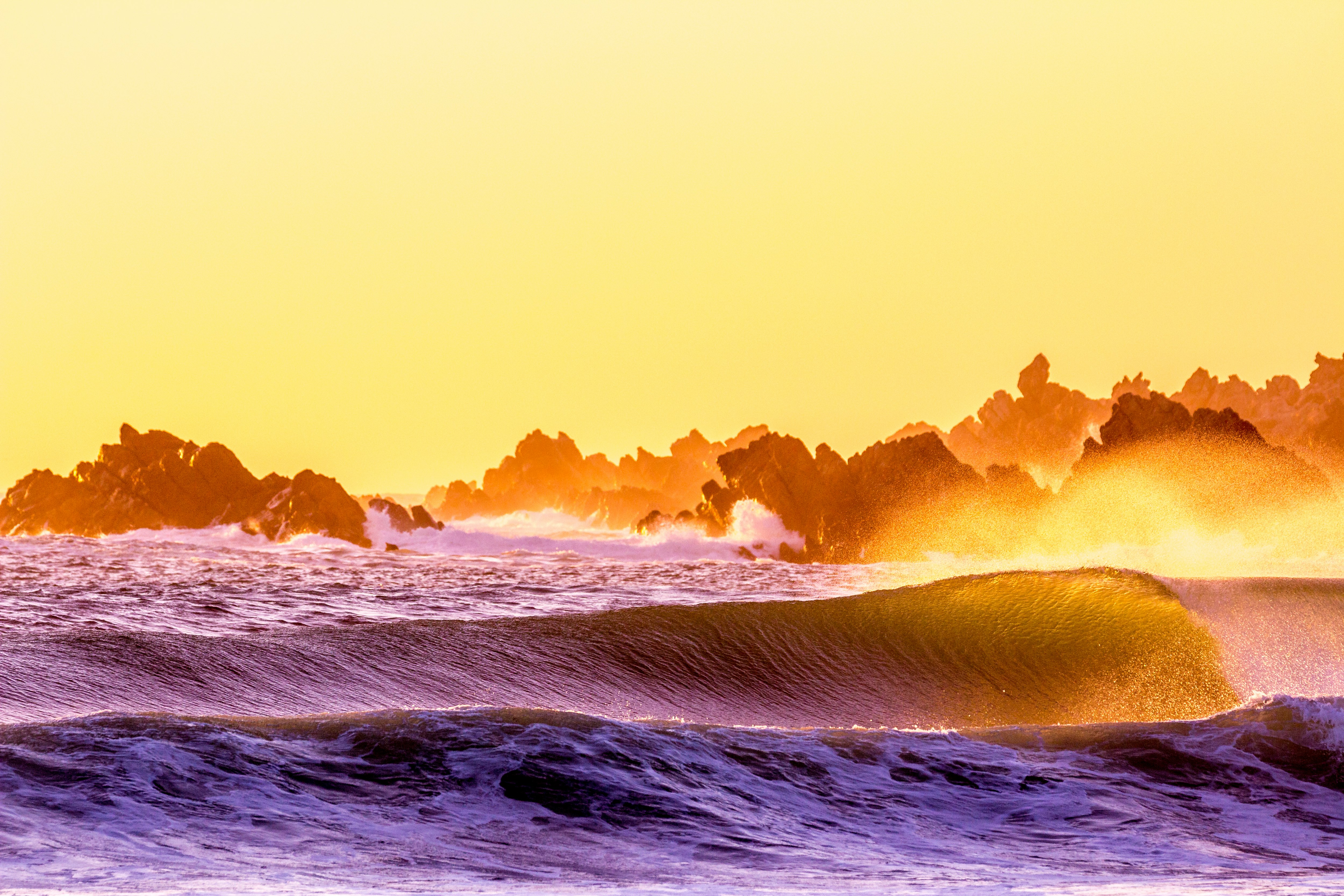 ocean waves under blue sky during daytime