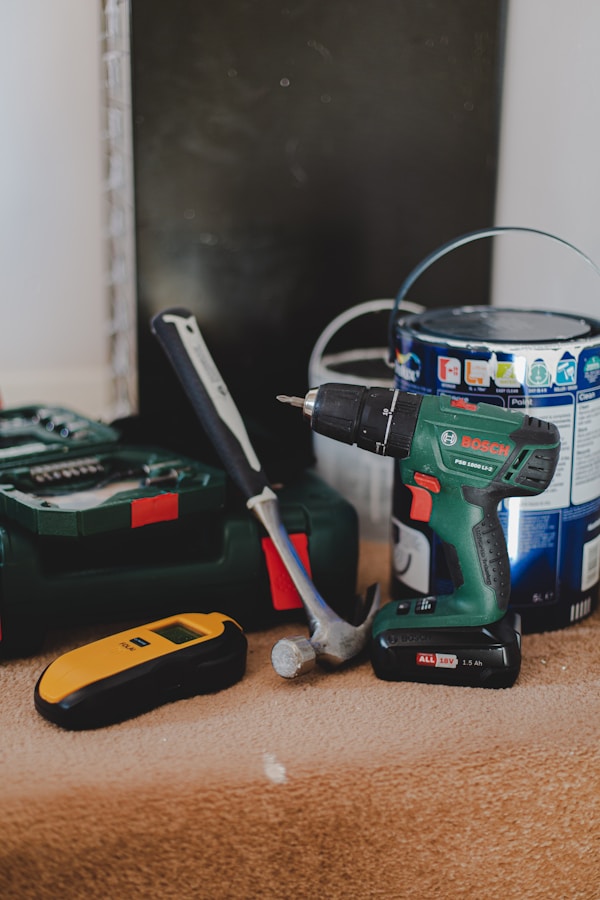 red and black cordless power drill beside black and red cordless power drillby Sam Clarke