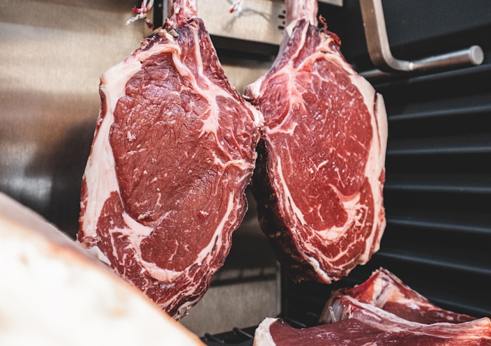 raw meat on stainless steel tray