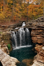 waterfalls in the middle of the forest