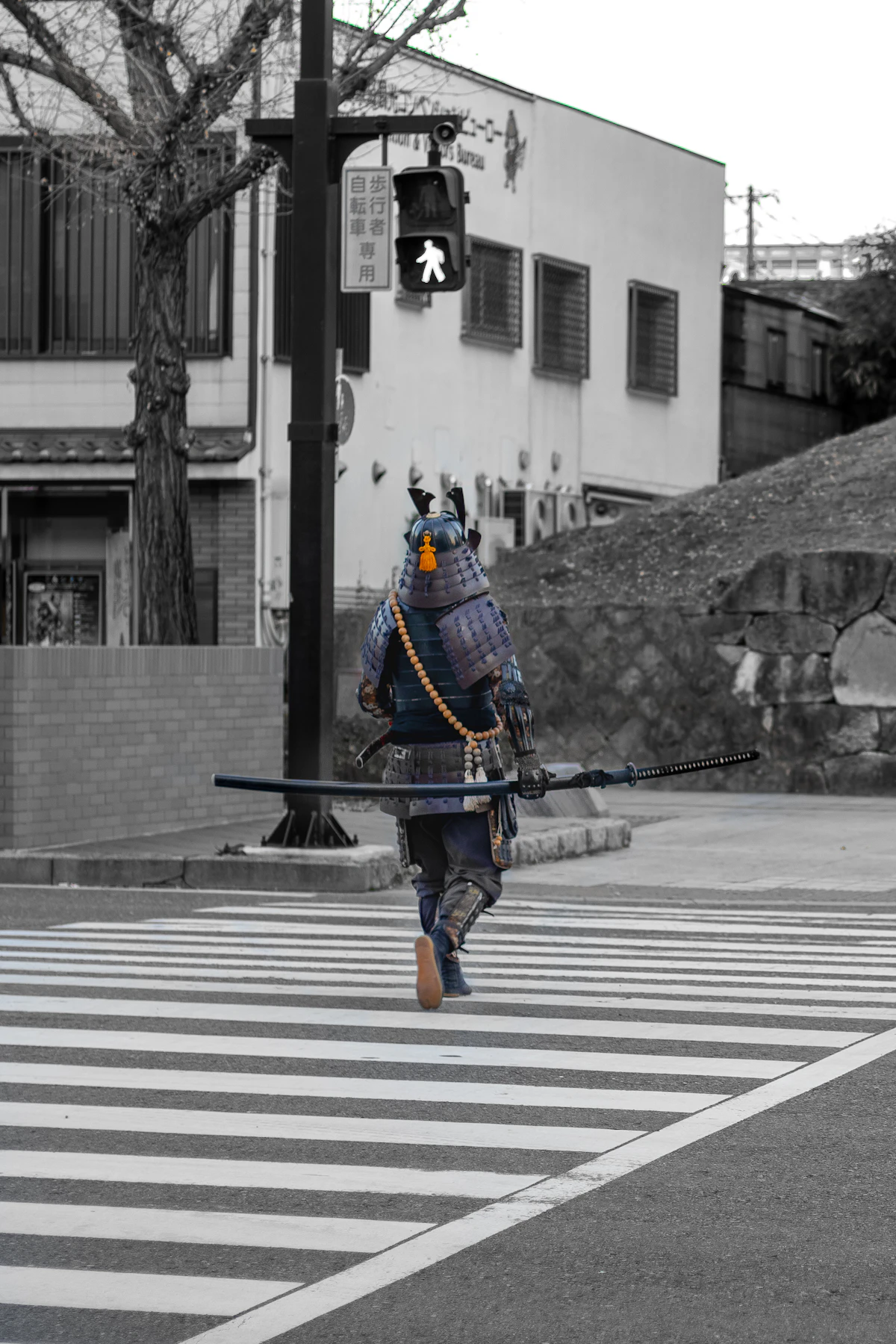 Armored figure walking a city crosswalk