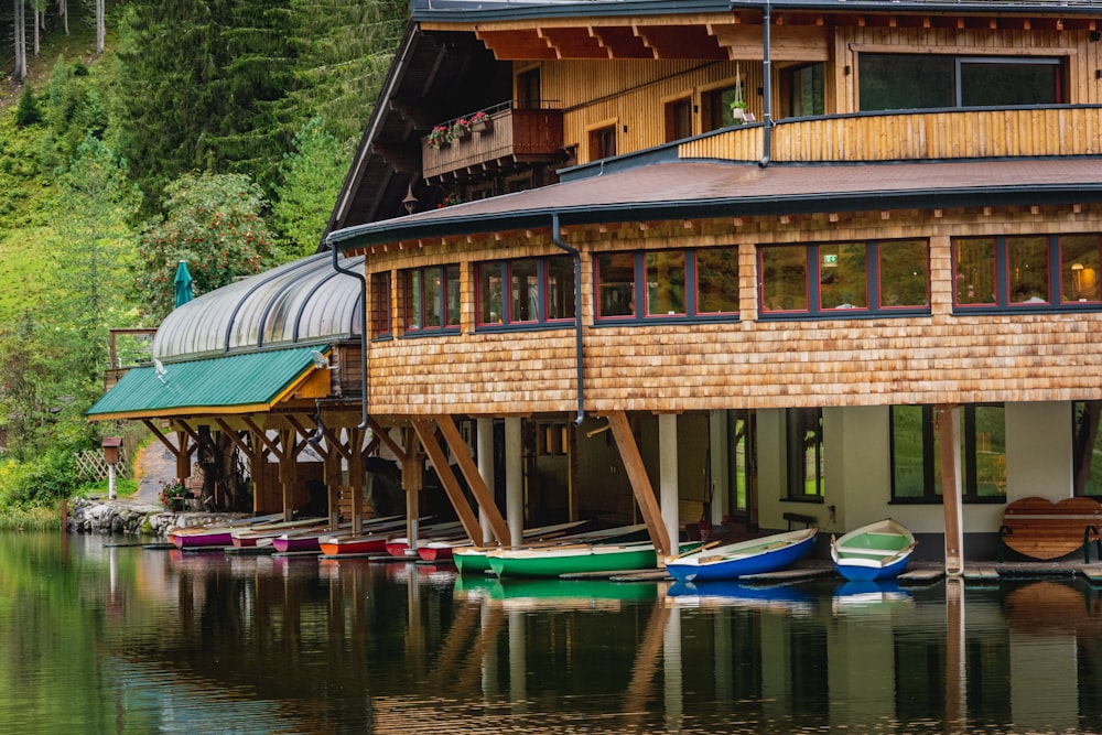 brown wooden house on body of water during daytime