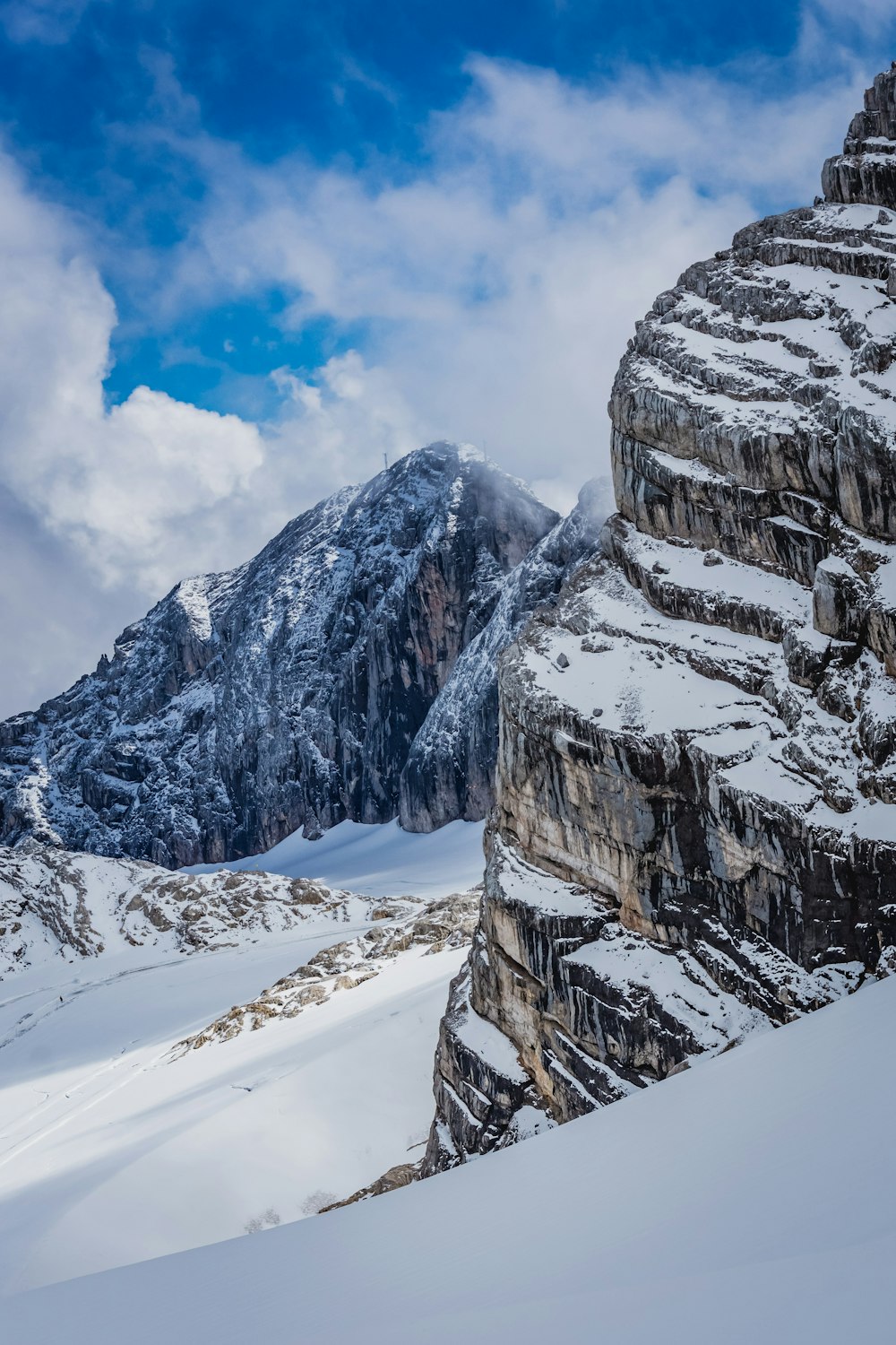 snow covered mountain under blue sky during daytime