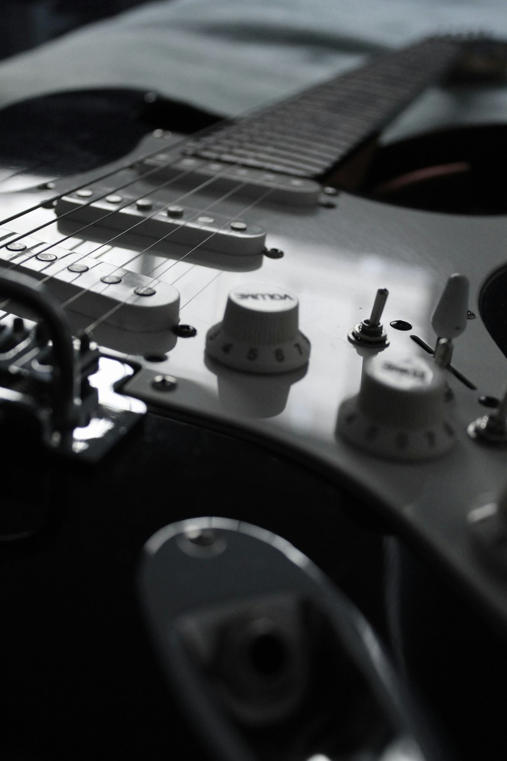 white and black electric guitar