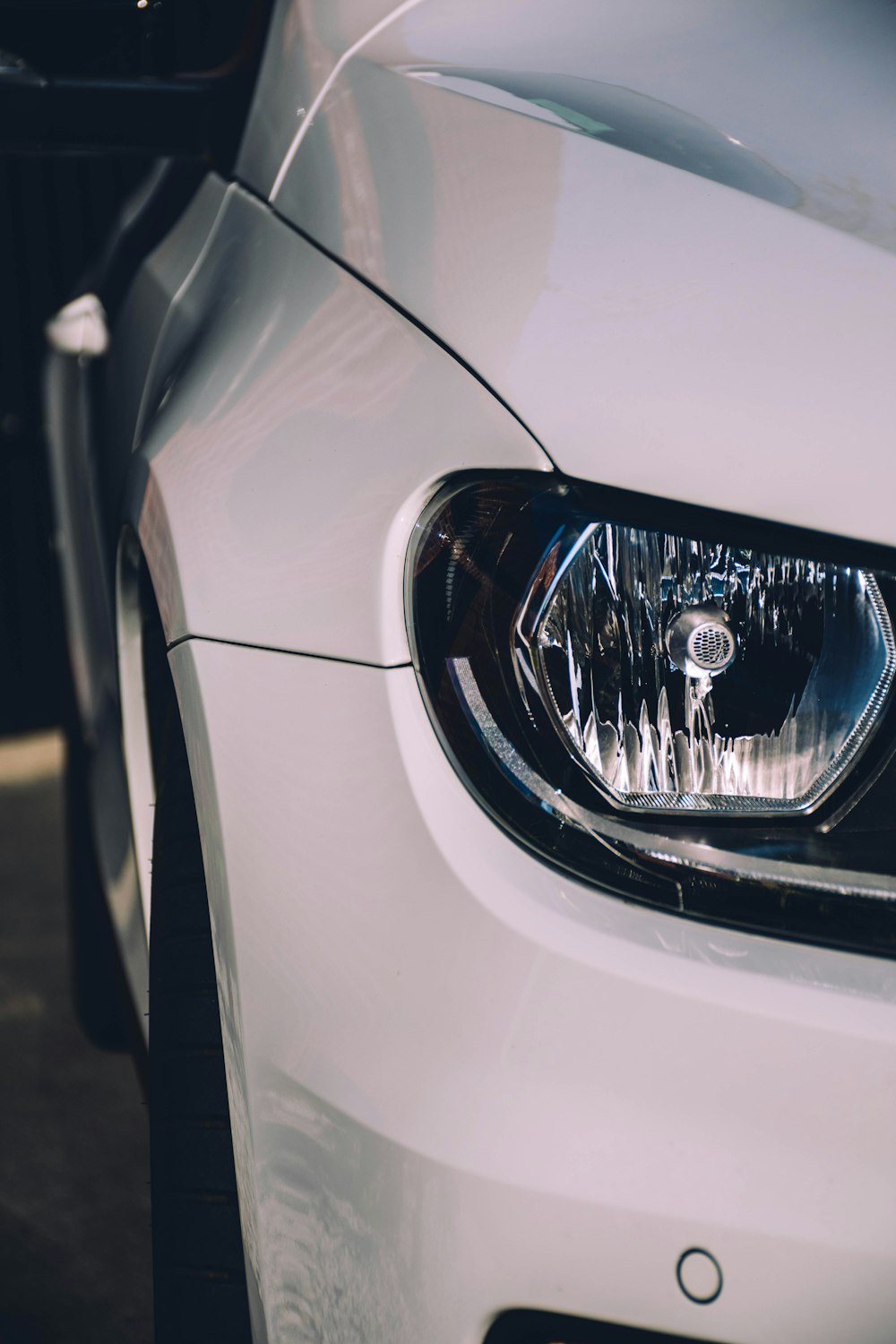 white car with silver headlight