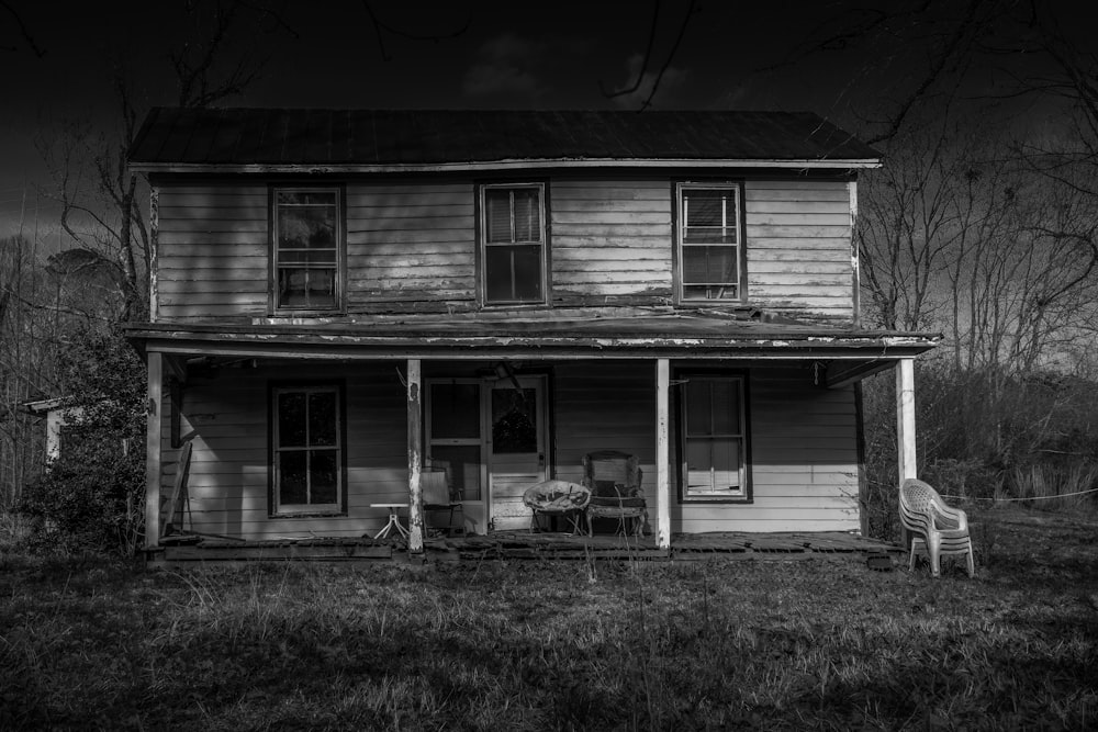 grayscale photo of wooden house
