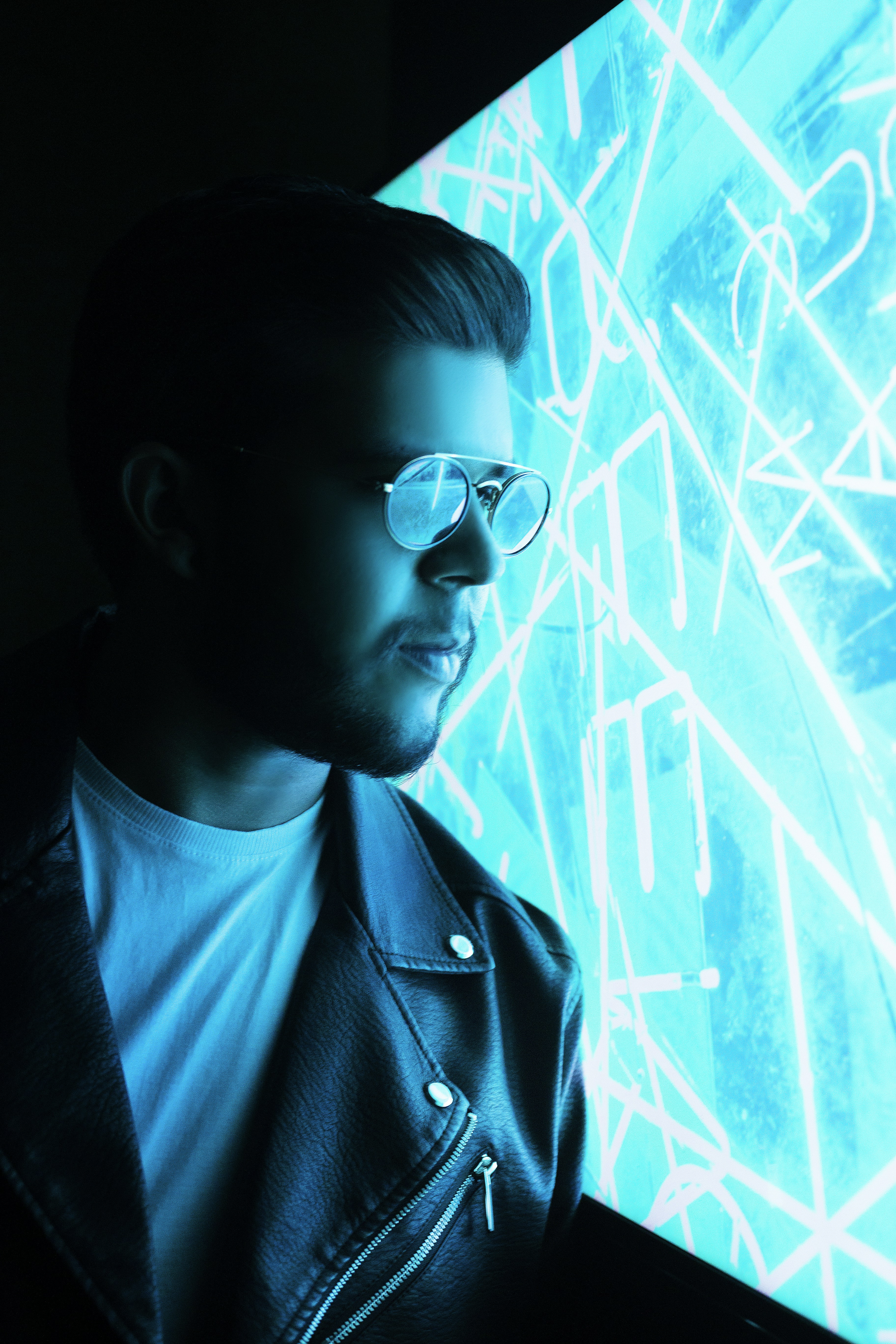 man in black sunglasses and black coat