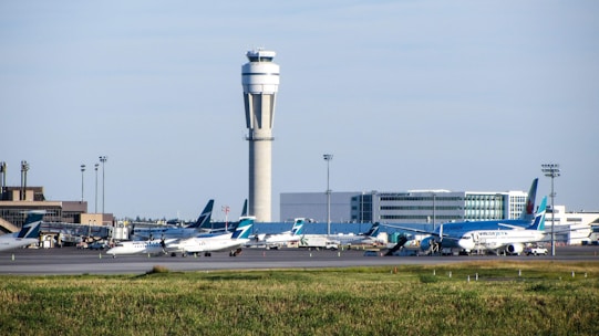 white passenger plane on airport during daytime