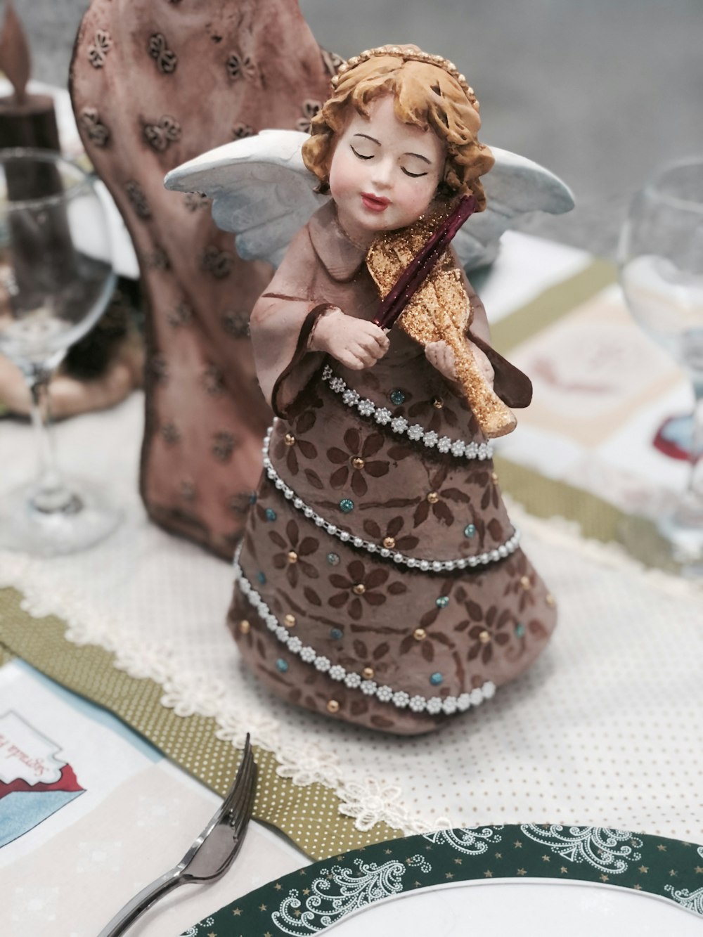 brown and white angel figurine