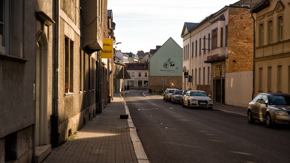 cars parked on side of the road during daytime