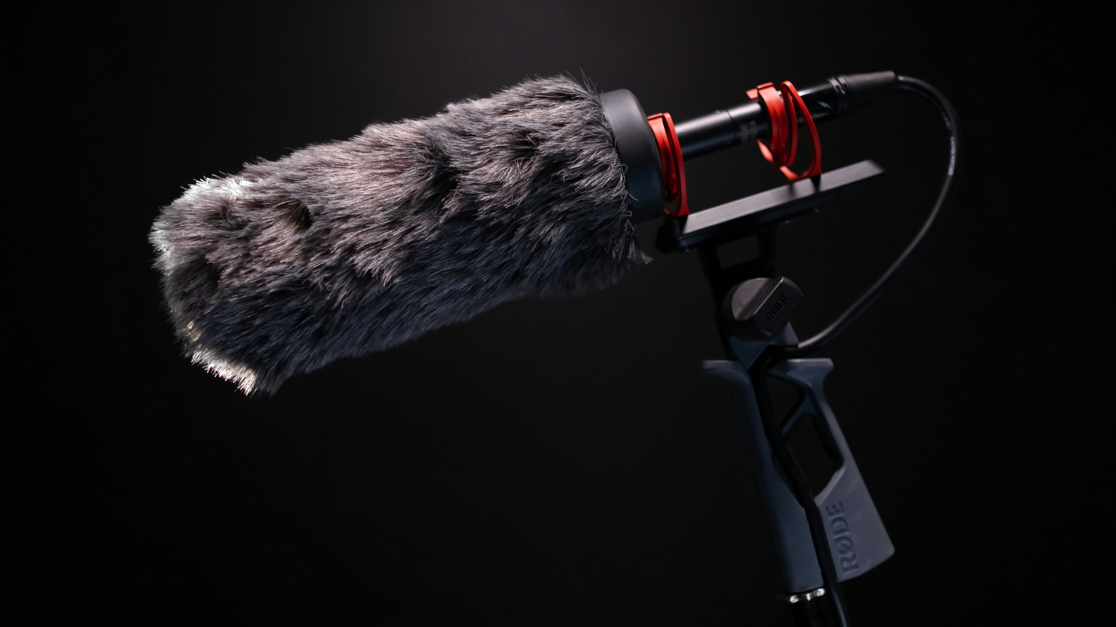 black and silver camera with black tripod