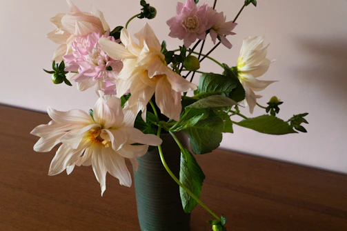 Elegant bouquet of fresh flowers on a wooden table with soft natural light
