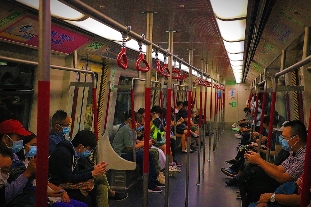 people sitting on train seat