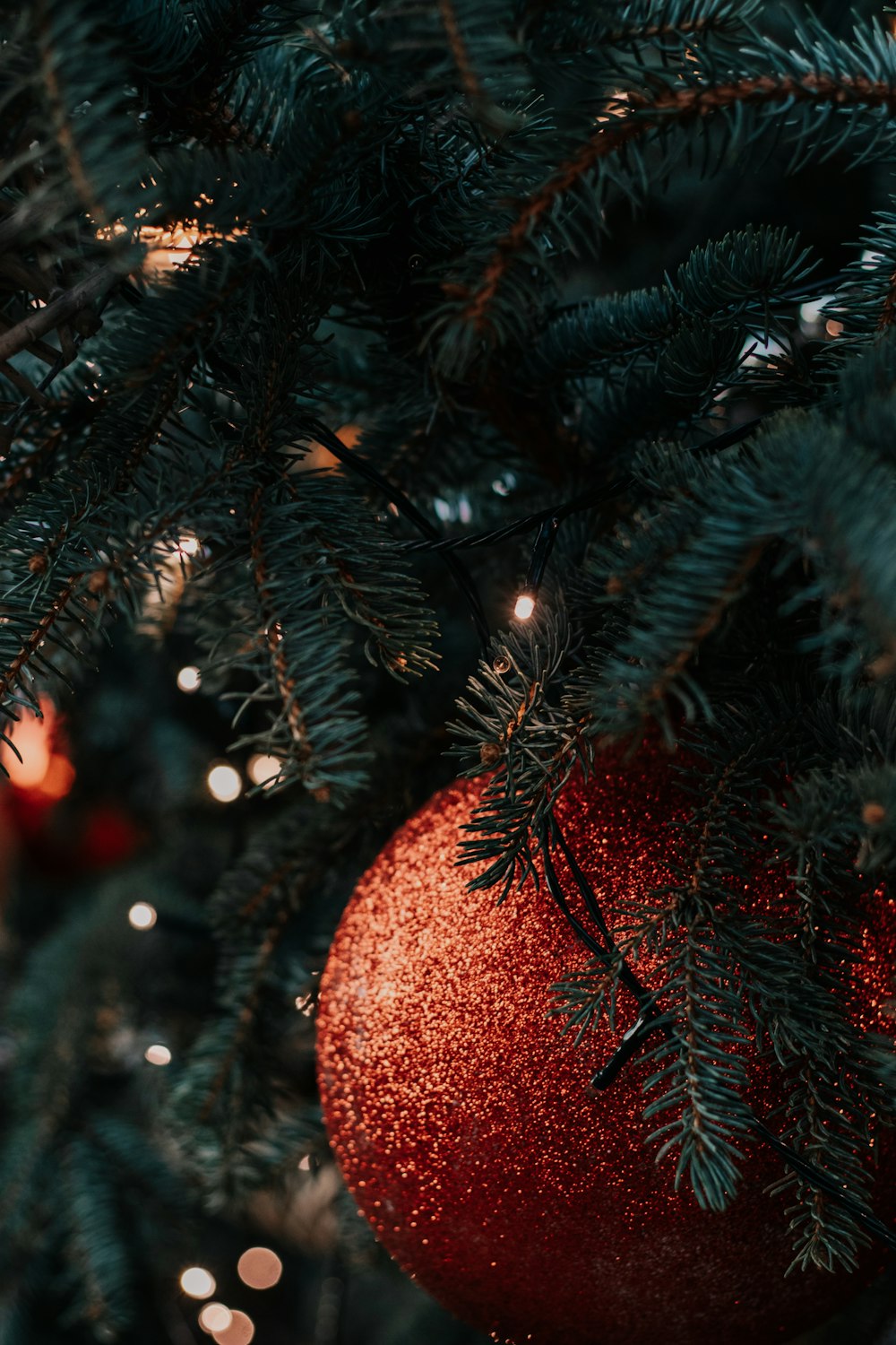 red and green christmas tree with baubles