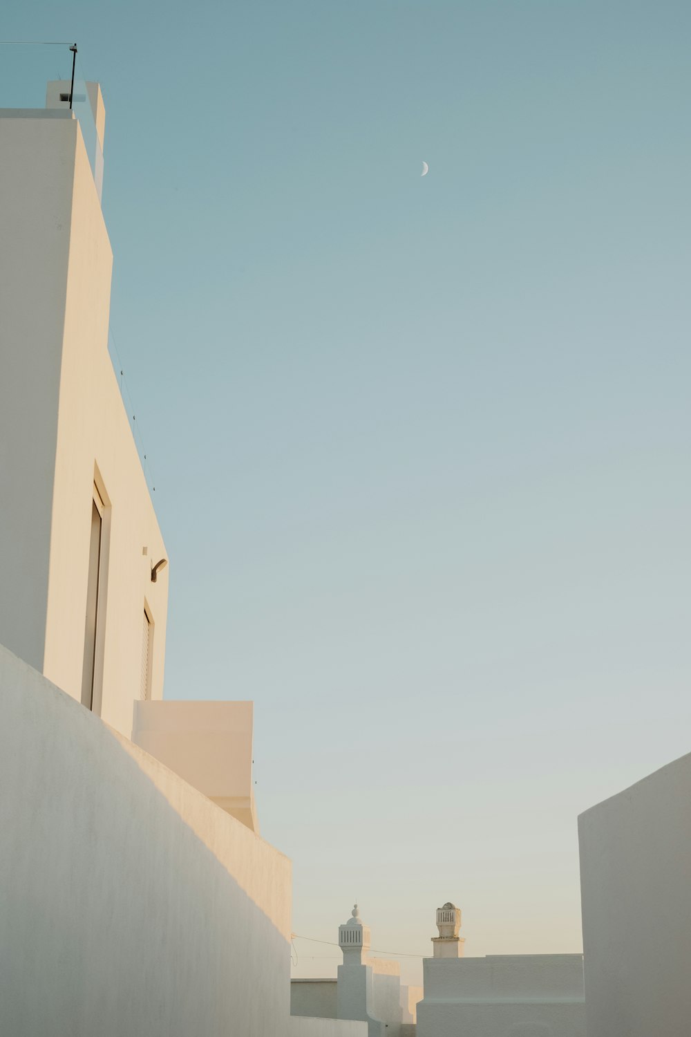 white concrete building under blue sky during daytime