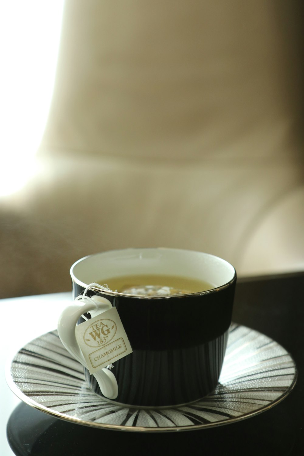 white ceramic mug on white ceramic saucer