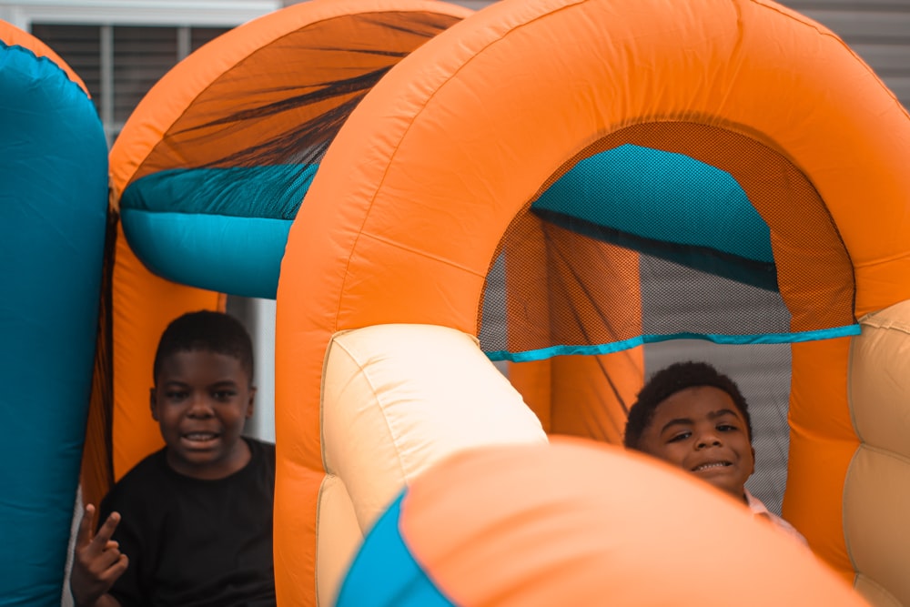 man in black shirt lying on inflatable ring