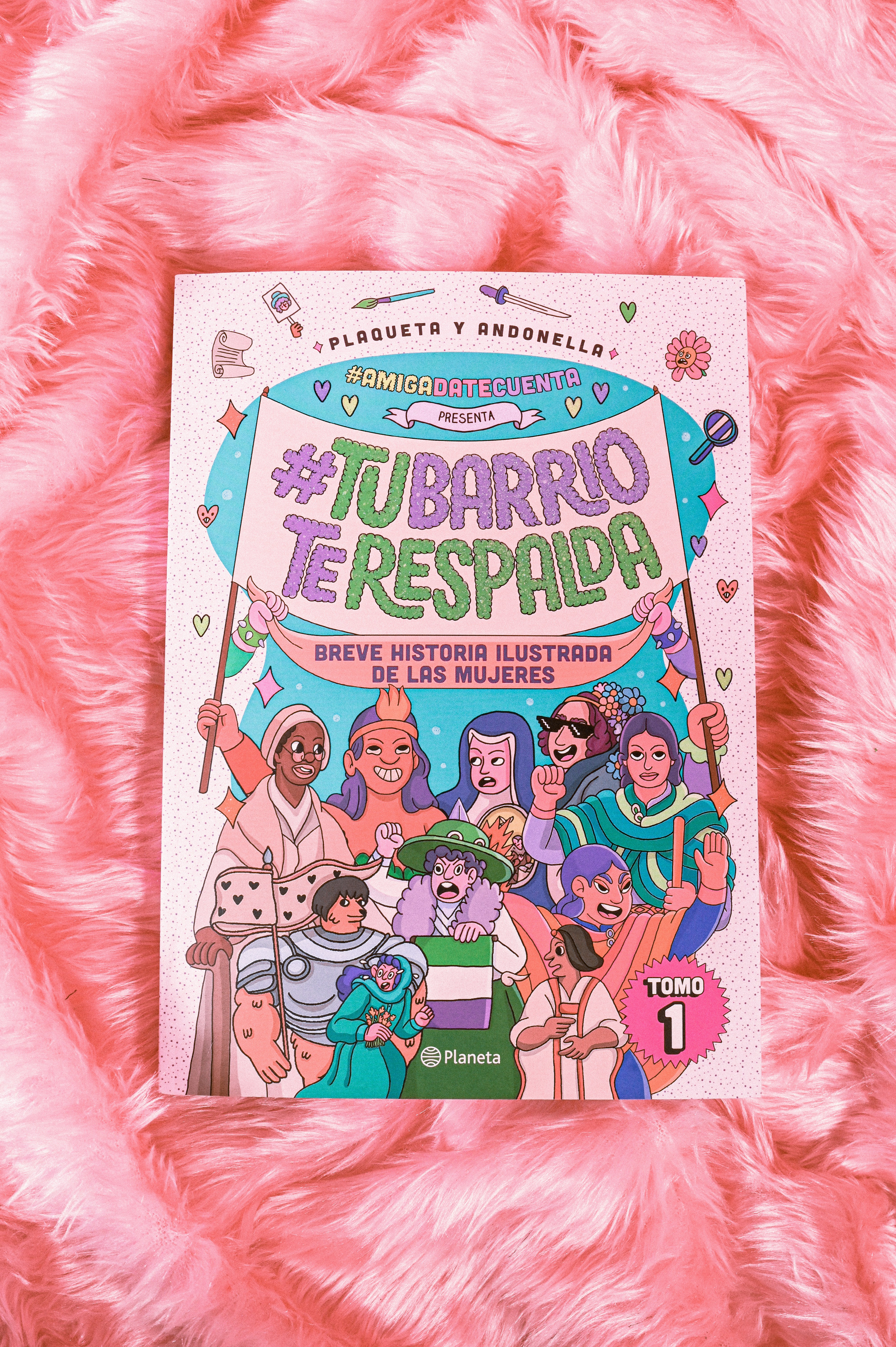 Book on top of pink fake fur