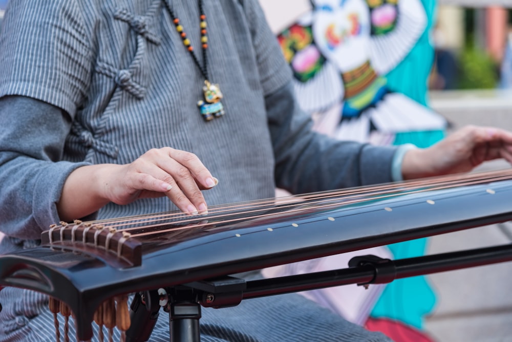 person playing piano during daytime