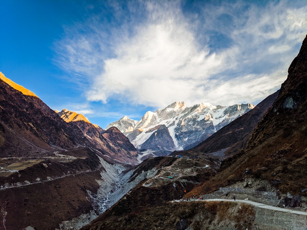 snow covered mountains under blue sky during daytime