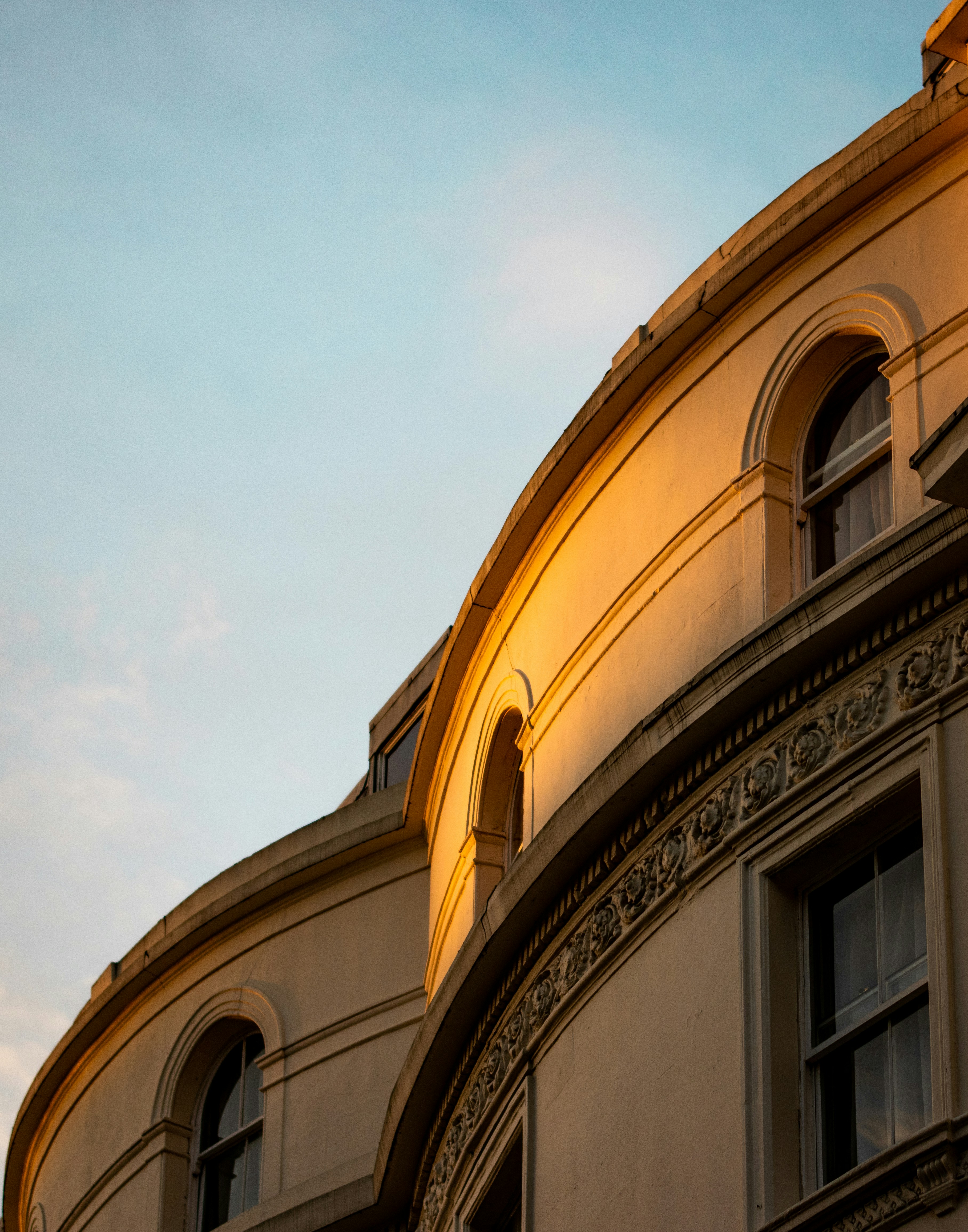 low angle photography of beige concrete building
