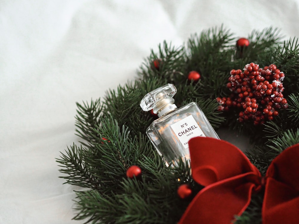 red rose and clear glass bottle