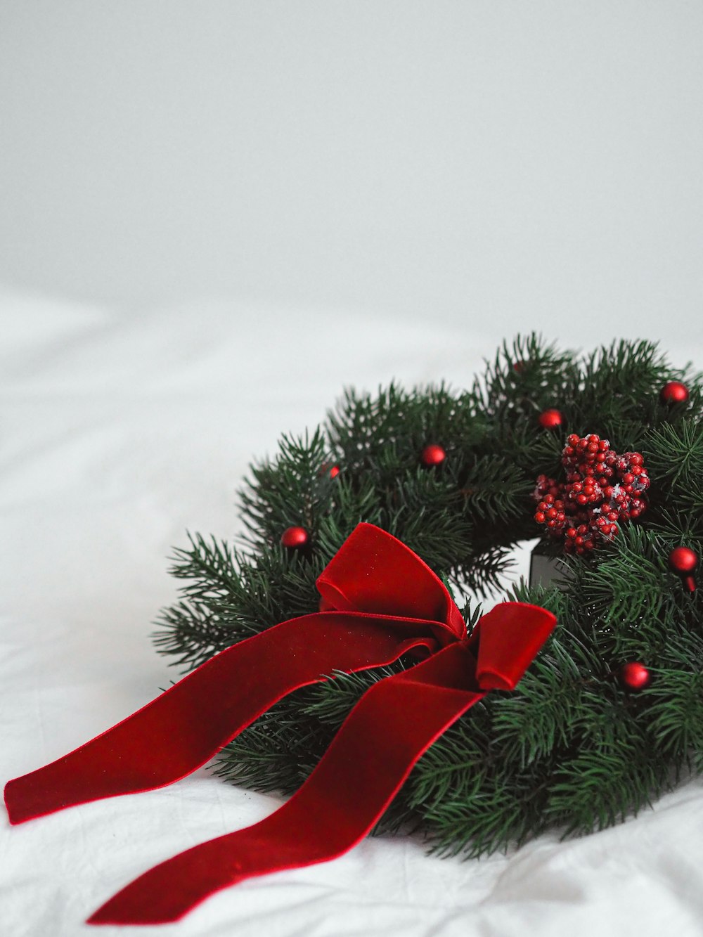 red ribbon on green christmas tree