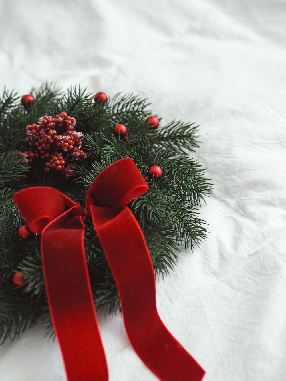 red ribbon on white textile