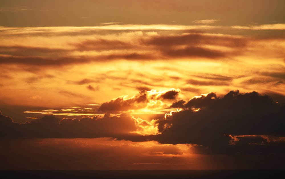 silhouette of clouds during sunset