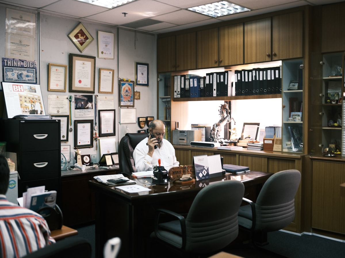Employment attorney using AI legal drafting software on a laptop in a 2026 law office