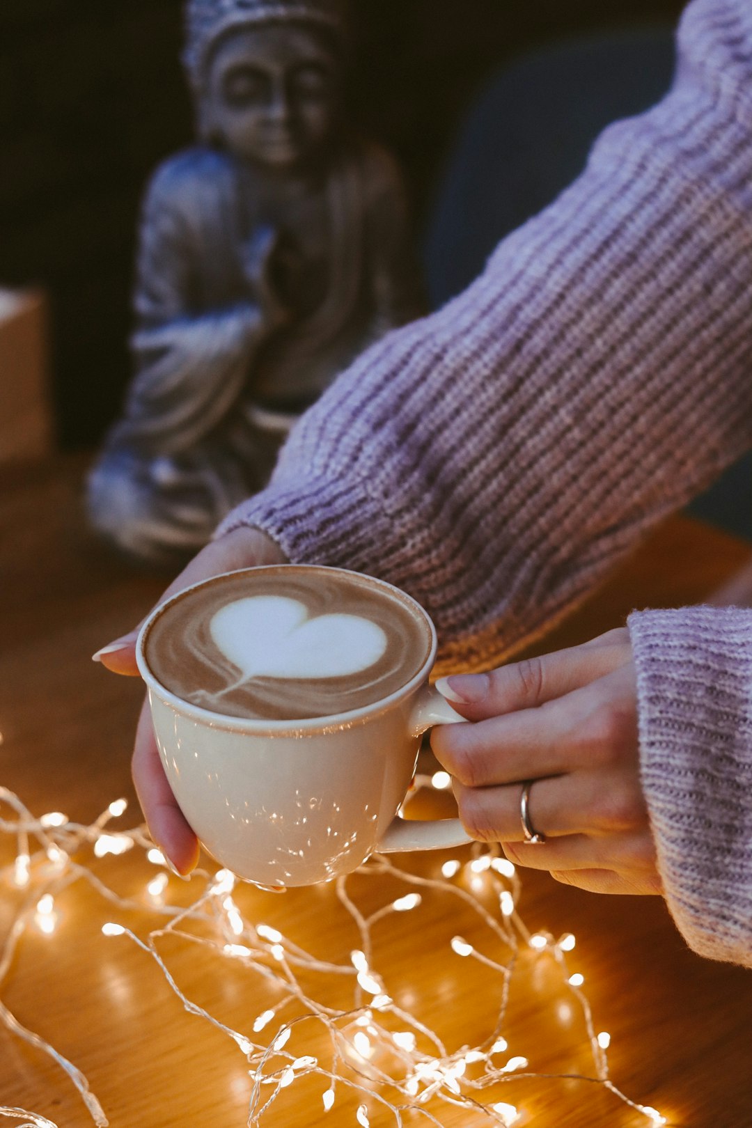 person holding white ceramic mug with coffee