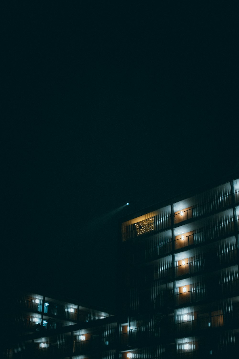 black and white high rise building during nighttime