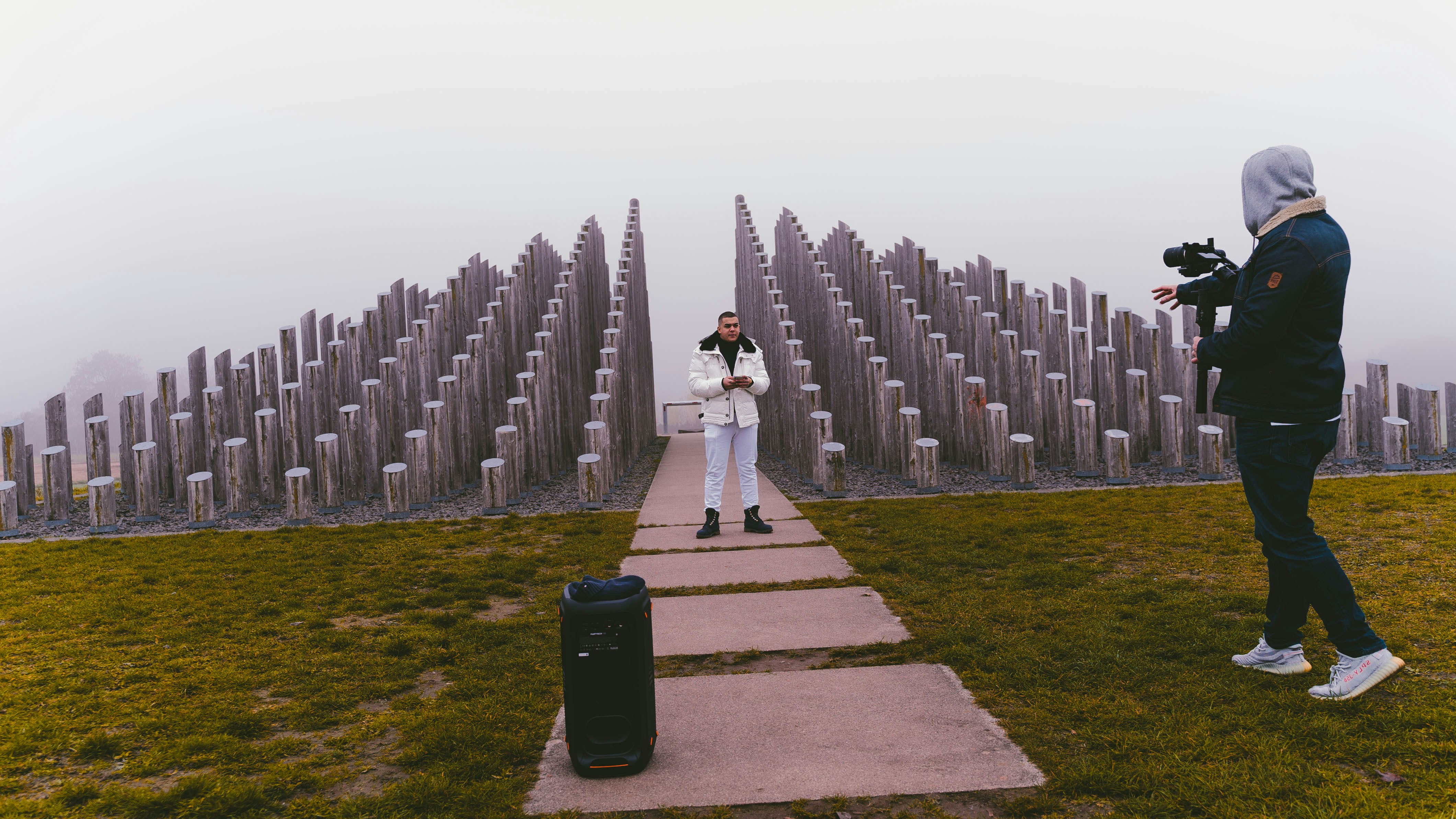 woman in white dress standing on green grass field during daytime