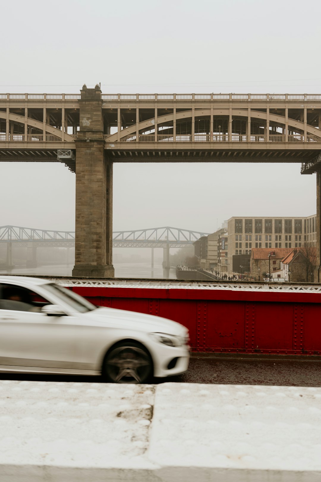 white car parked near bridge