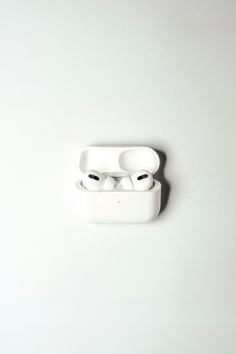 white apple earpods in white case