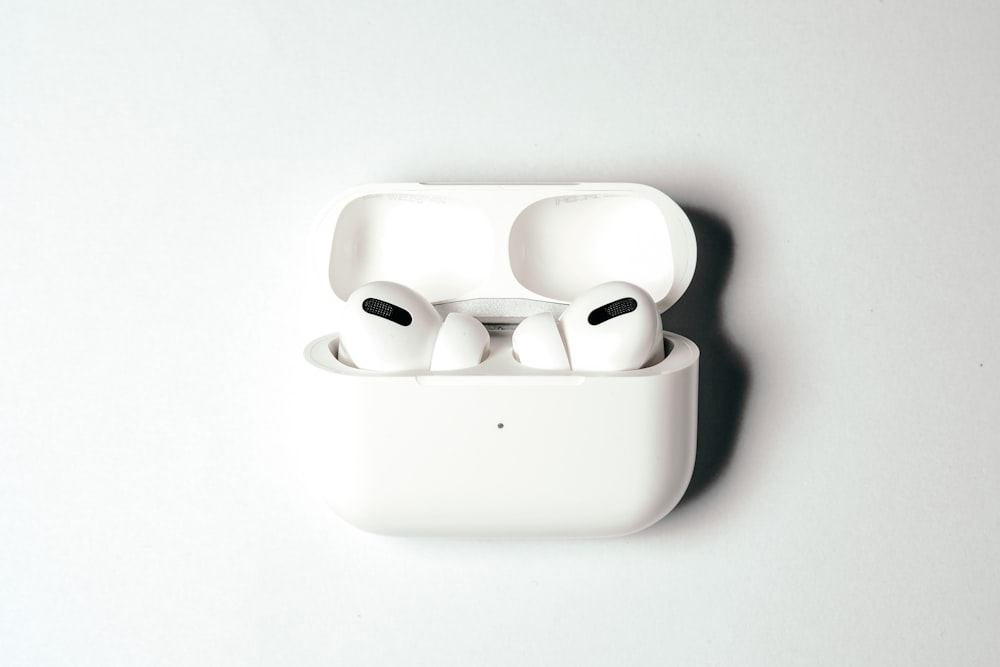 white apple earpods in white case