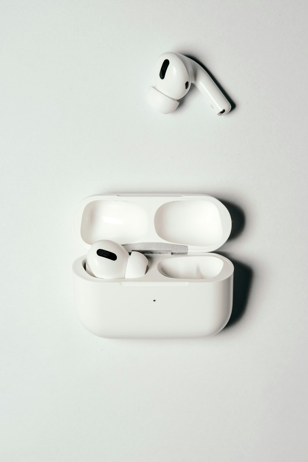 white apple earpods in white case