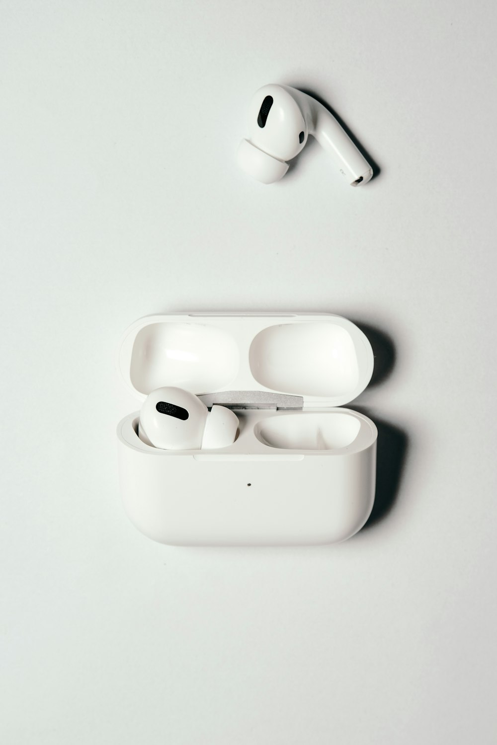 person holding white apple earpods photo – Free Grey Image on Unsplash