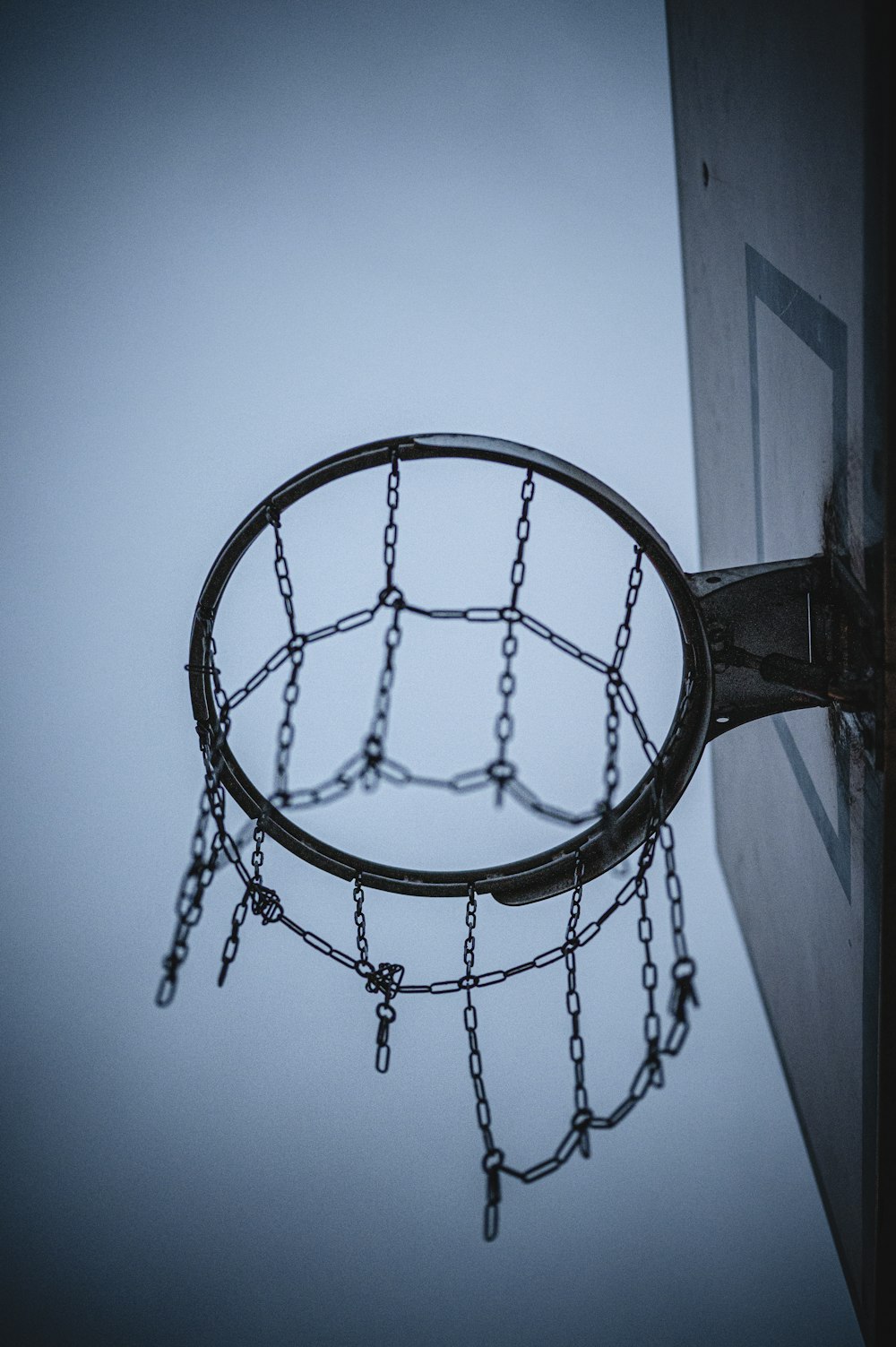 black basketball hoop under blue sky during daytime