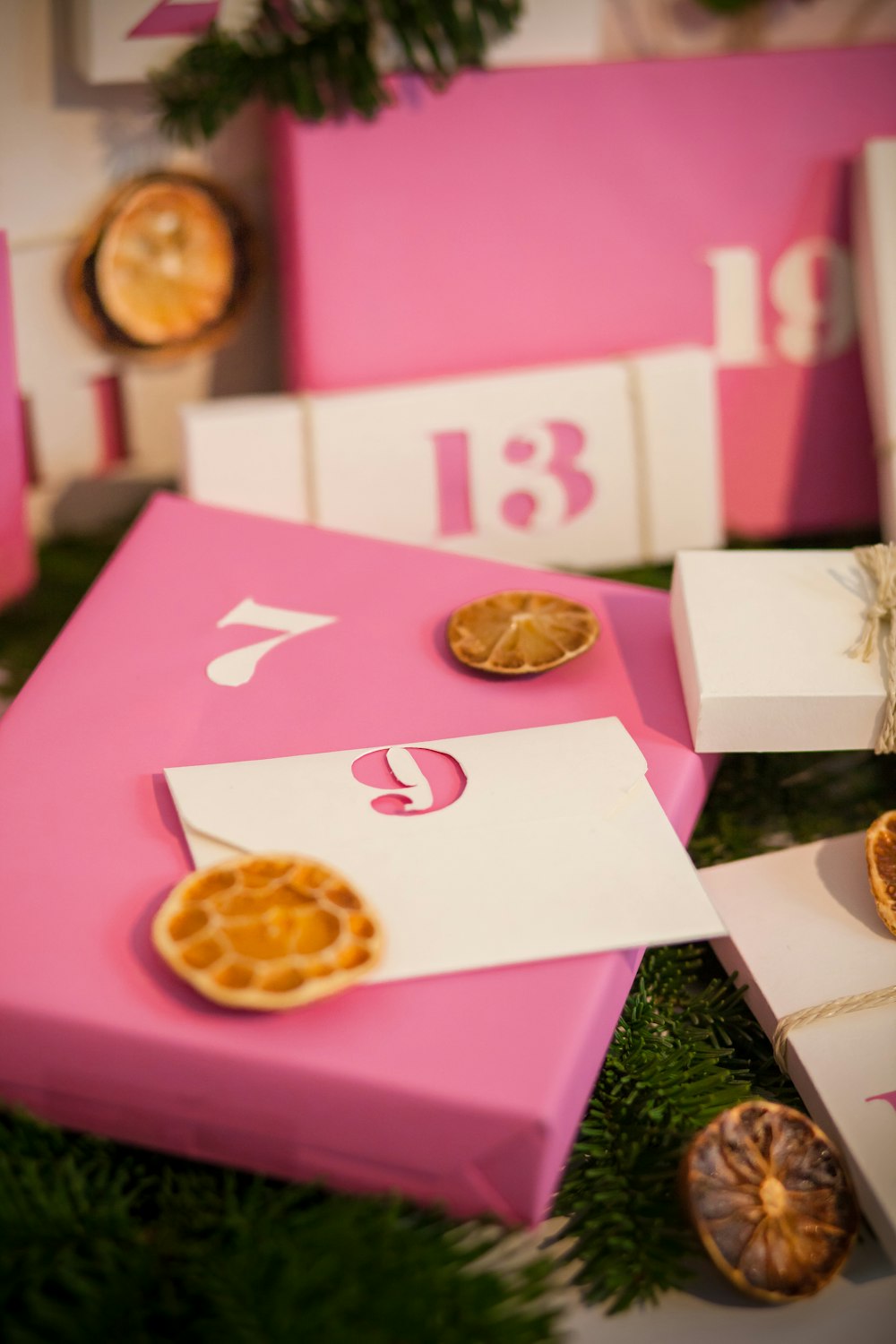 pink and white box with gold round coin