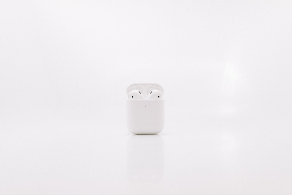 white apple airpods charging case