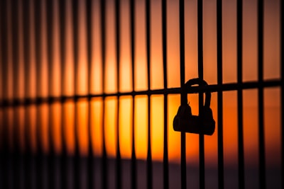 silhouette of padlock on window symbolic zoom background