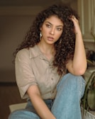 woman in brown button up shirt and blue denim jeans