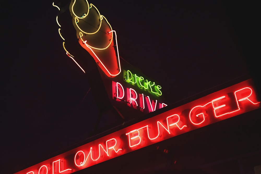 a neon sign for a drive in restaurant