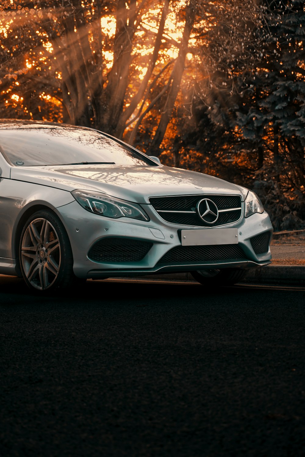 silver mercedes benz coupe on road during daytime